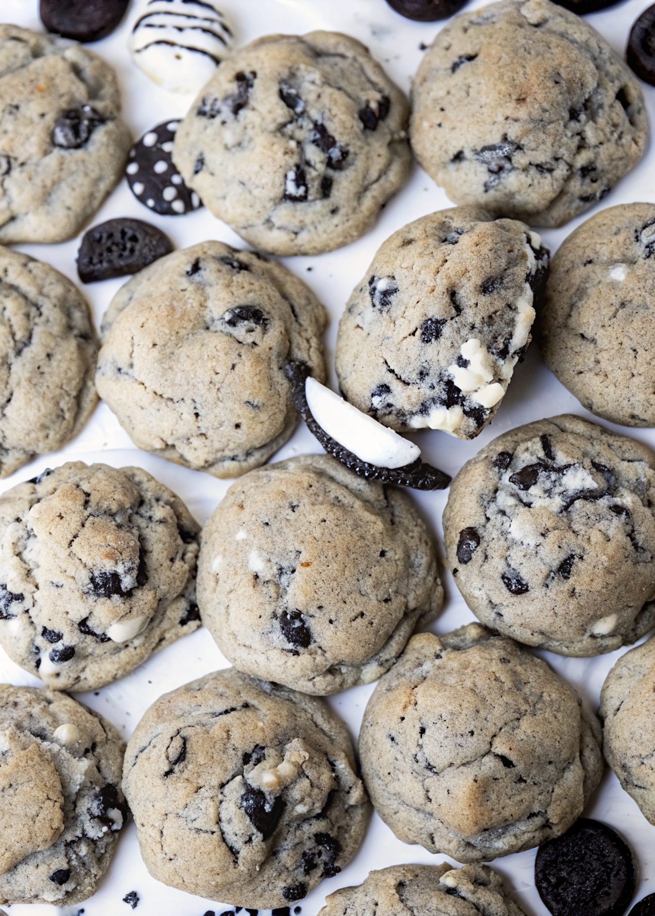 Stack of cookies and cream cookies beside a glass of milk